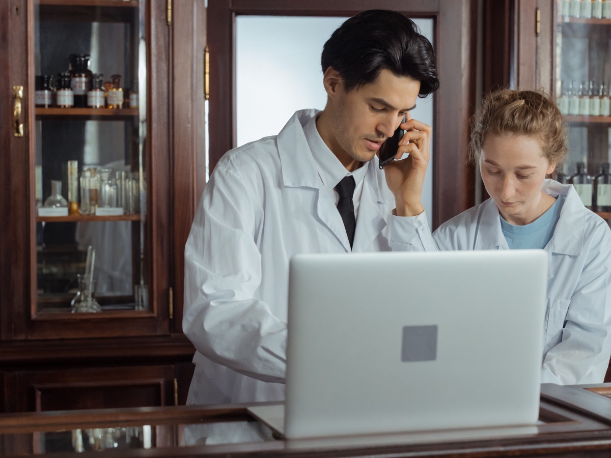 Pharmacy professionals reviewing eligibility information