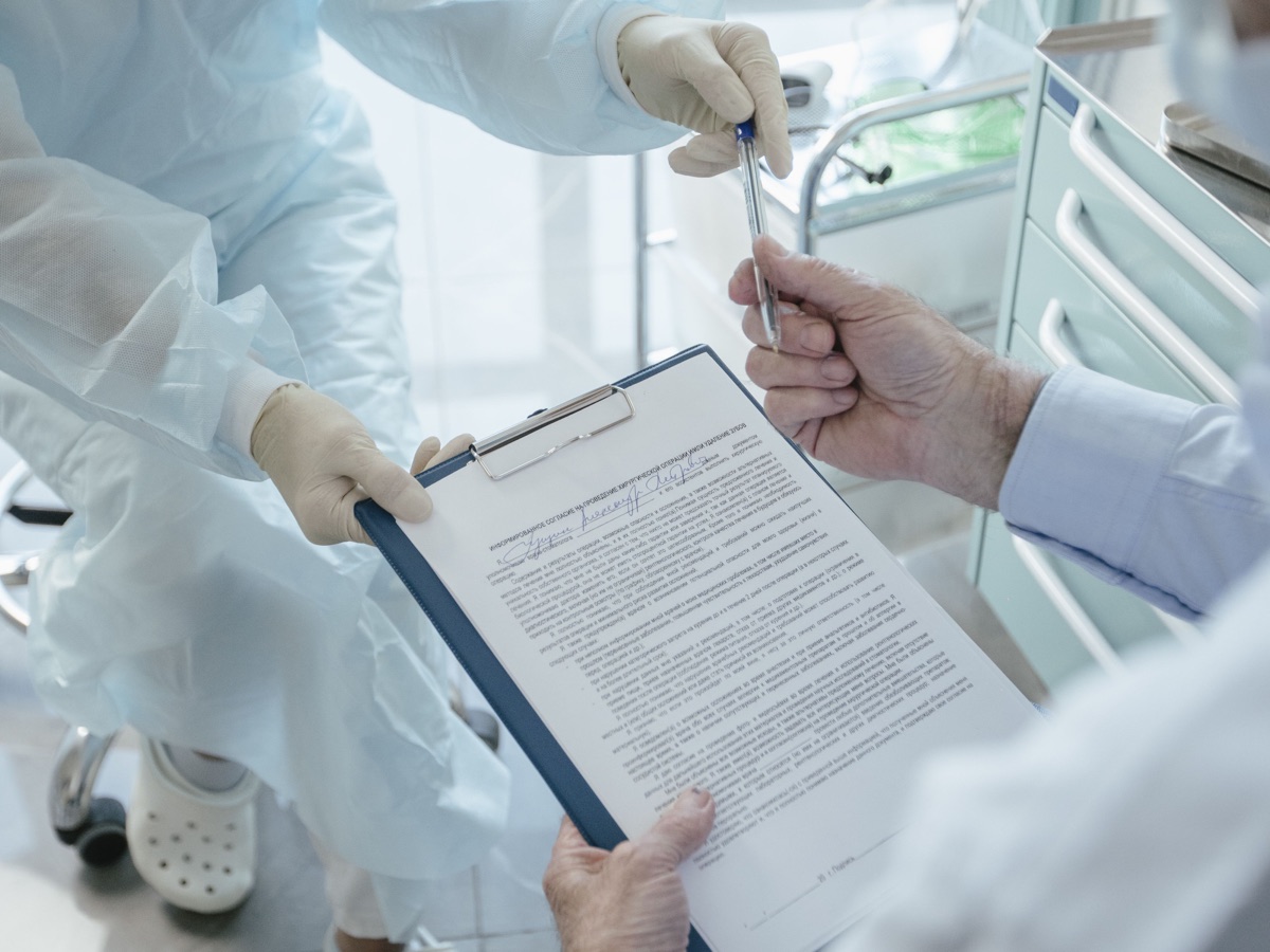 Doctor reviewing benefit documents with a patient