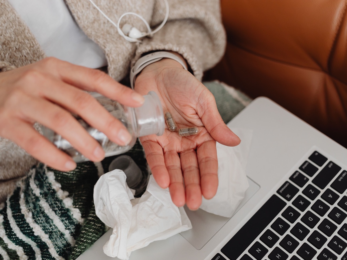 Patient reviewing prescription information on a laptop