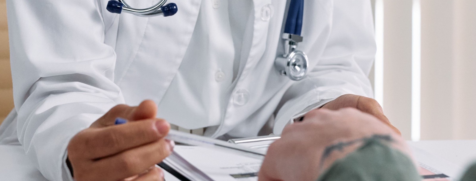 Doctor reviewing healthcare benefits with a patient