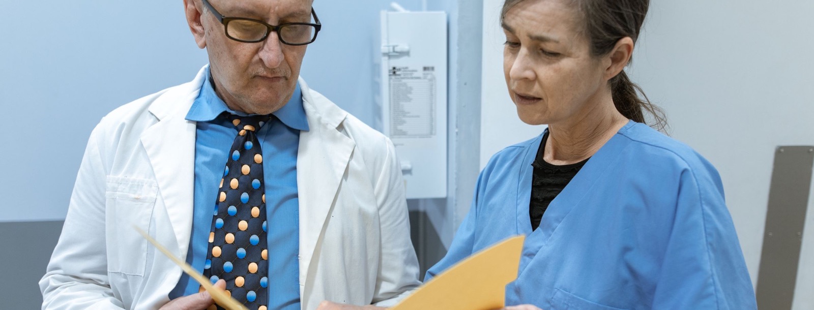 Healthcare professionals reviewing prescription records